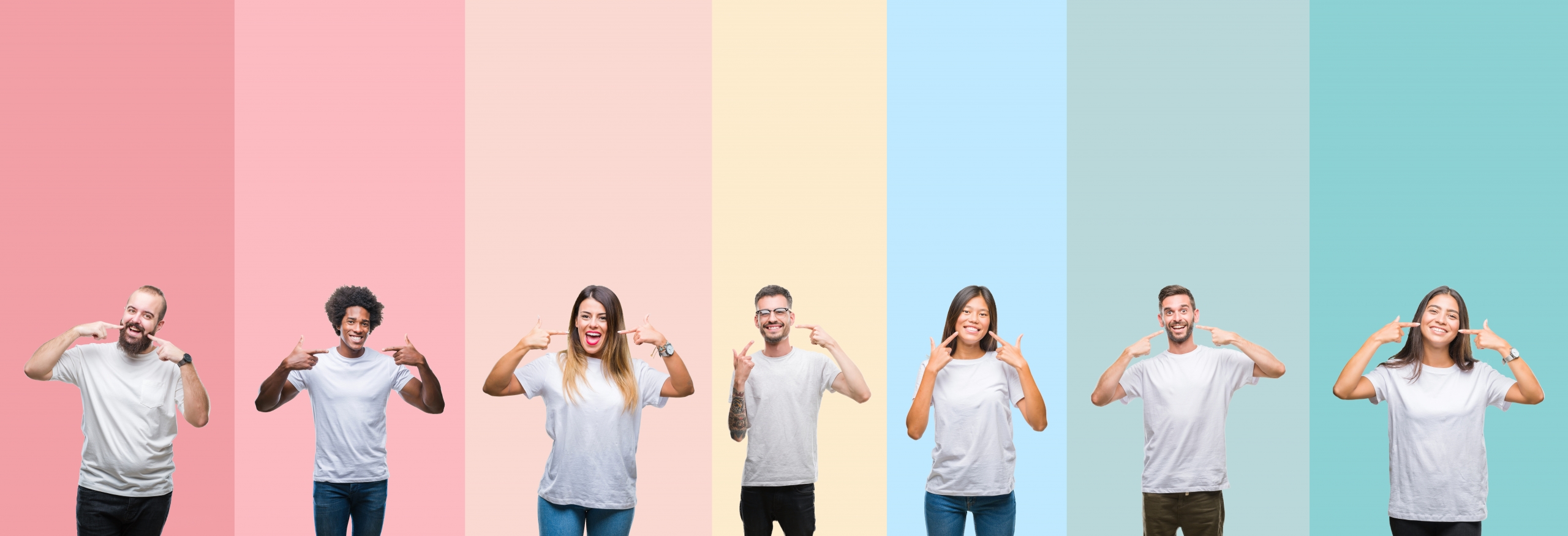 Collage of different ethnics young people wearing white t-shirt over colorful isolated background smiling confident showing and pointing with fingers teeth and mouth. Health concept.
